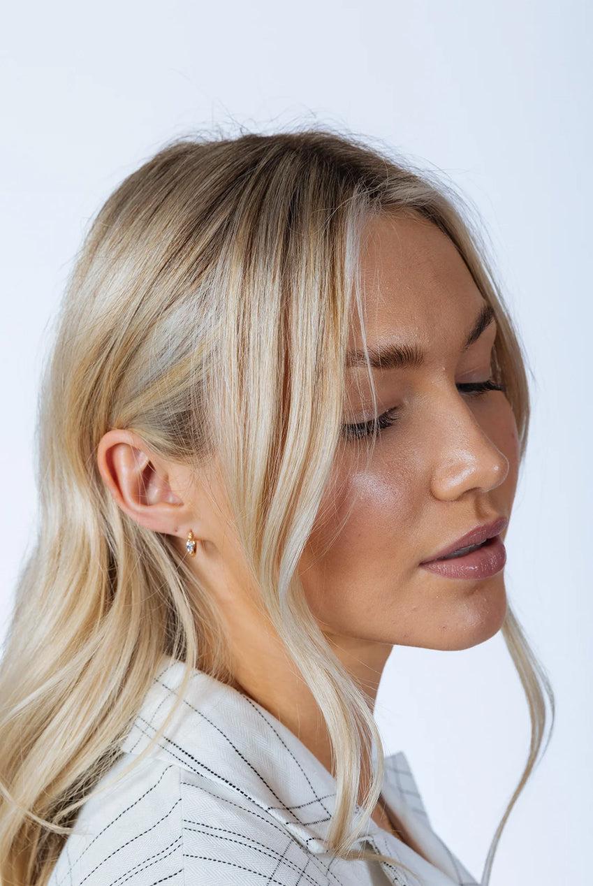 goddiva Oval Crystal Huggie Hoops by SVNX