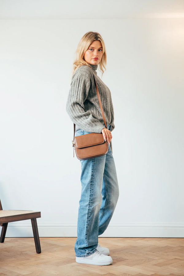 Goddiva Rounded Cross Body Bag In Brown By SVNX