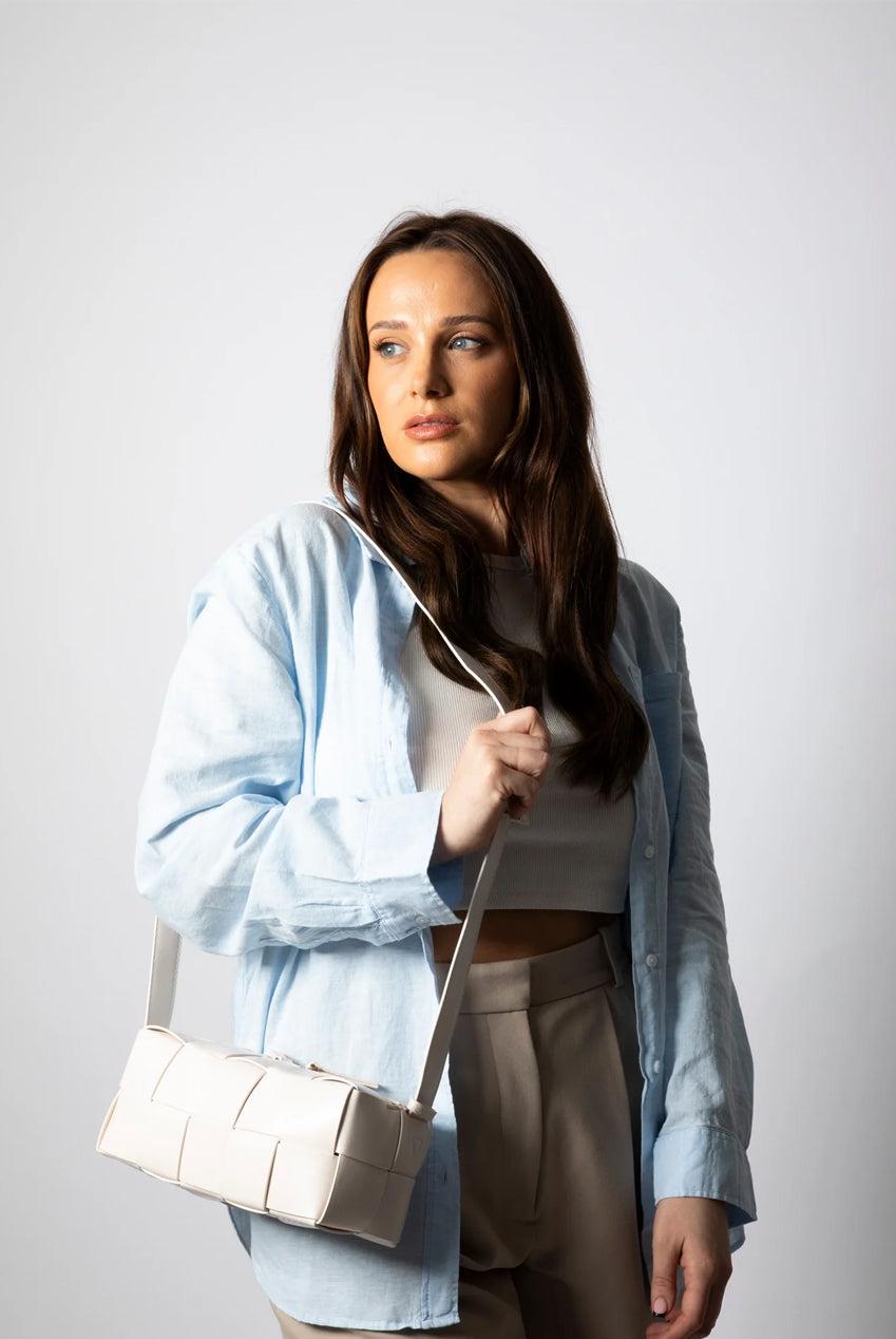 goddiva Woven PU Shoulder Bag In Cream by SVNX