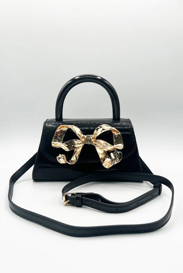 Goddiva Metallic Bow Top Handle Bag In Black By SVNX