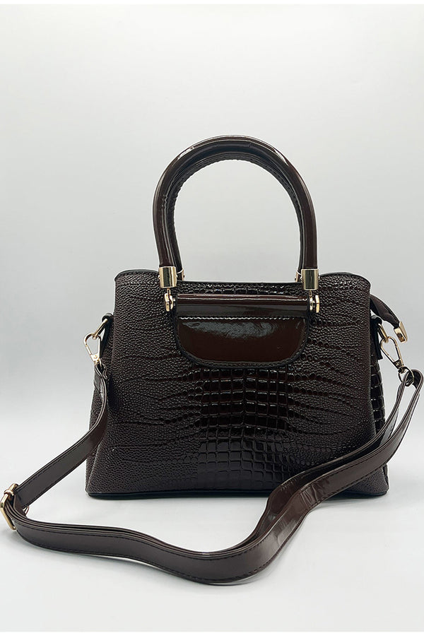 Goddiva Patent Croc Top Handle Bag In Brown By SVNX
