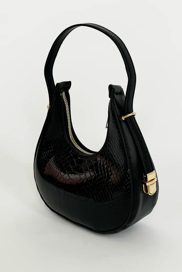 Goddiva Round Shoulder Bag In Shiny Faux Croc By SVNX