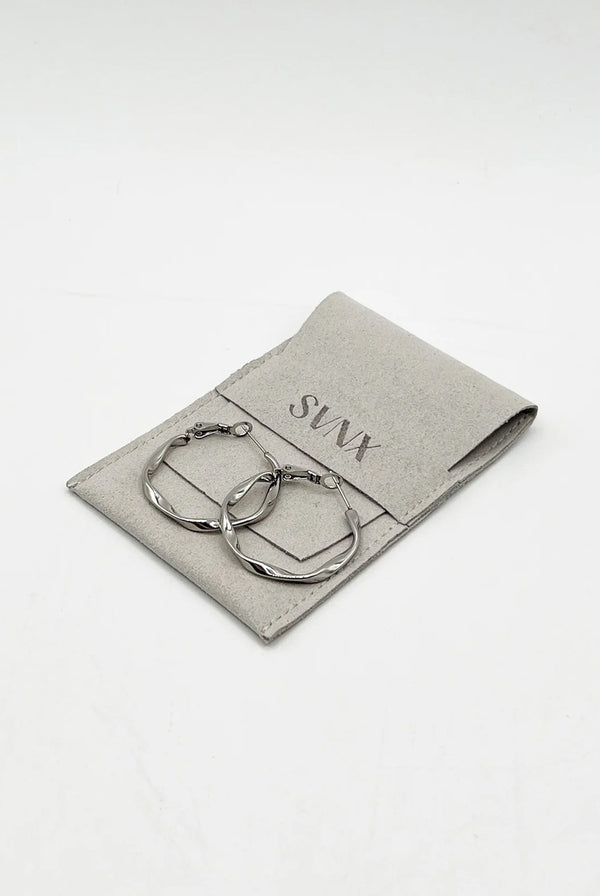 Goddiva Twist Hoops In Silver - Pouch Included By SVNX