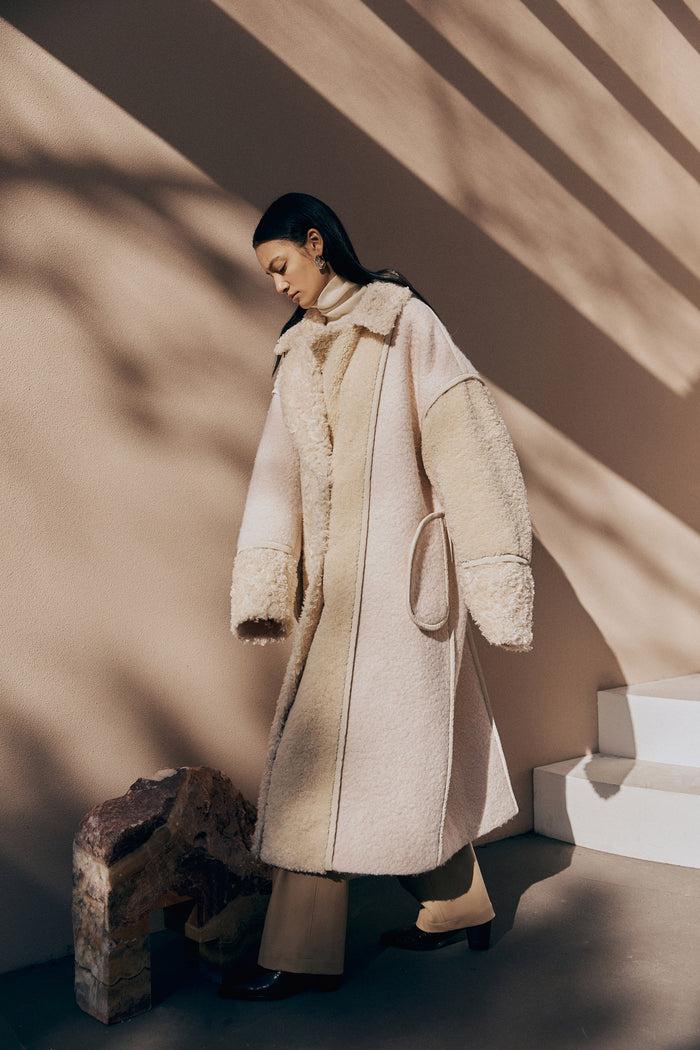 goen.j Inverted-seam faux shearling patchwork coat