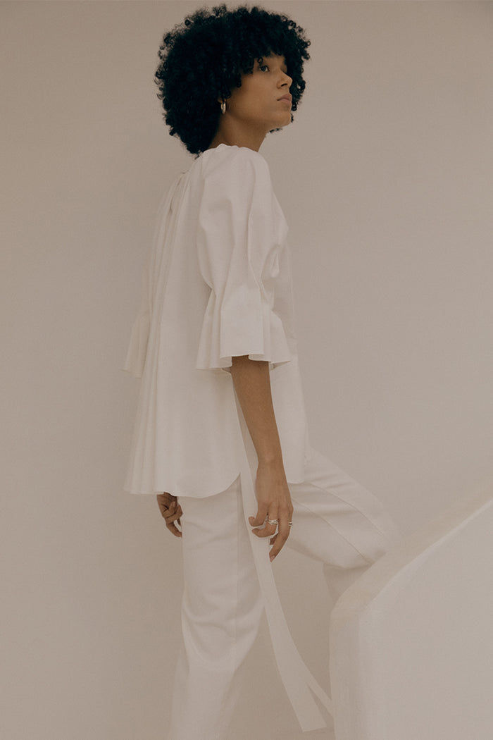 goen.j Pleated cotton-blend peplum top IVORY