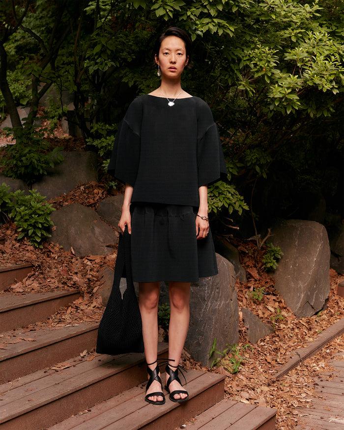 goen.j Pleated peplum sleeved top