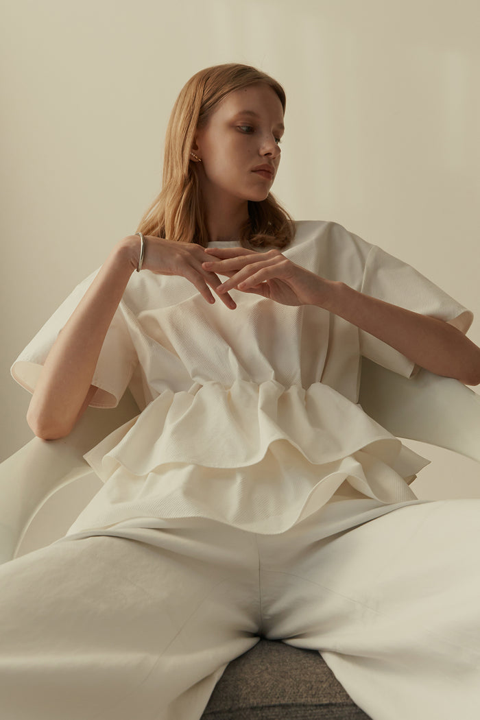goen.j Ruffled peplum cotton-blend twill top IVORY
