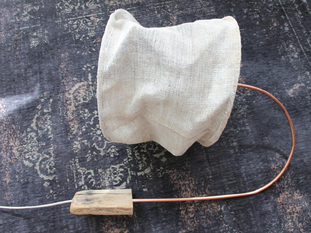 Greige Copper Tube And Driftwood Wall Lamp With Rough Linen Sack Shade