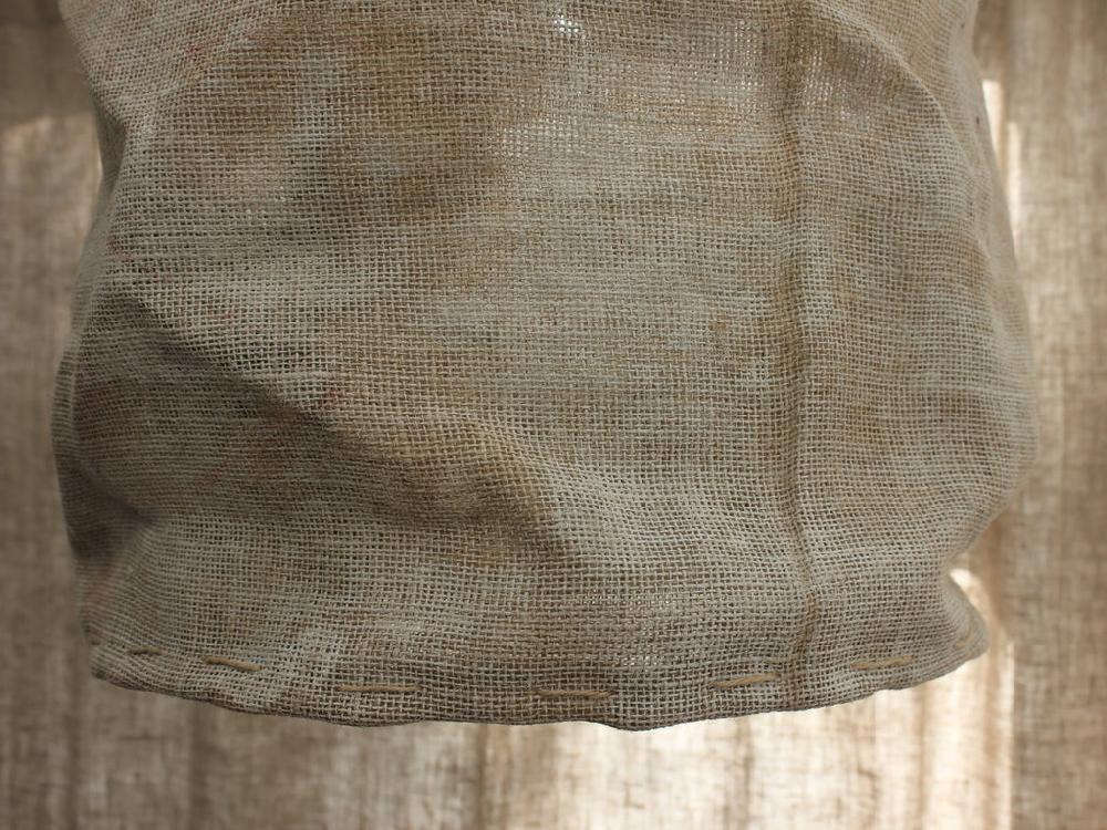 Greige Copper Tube And Driftwood Wall Lamp With Rough Linen Sack Shade