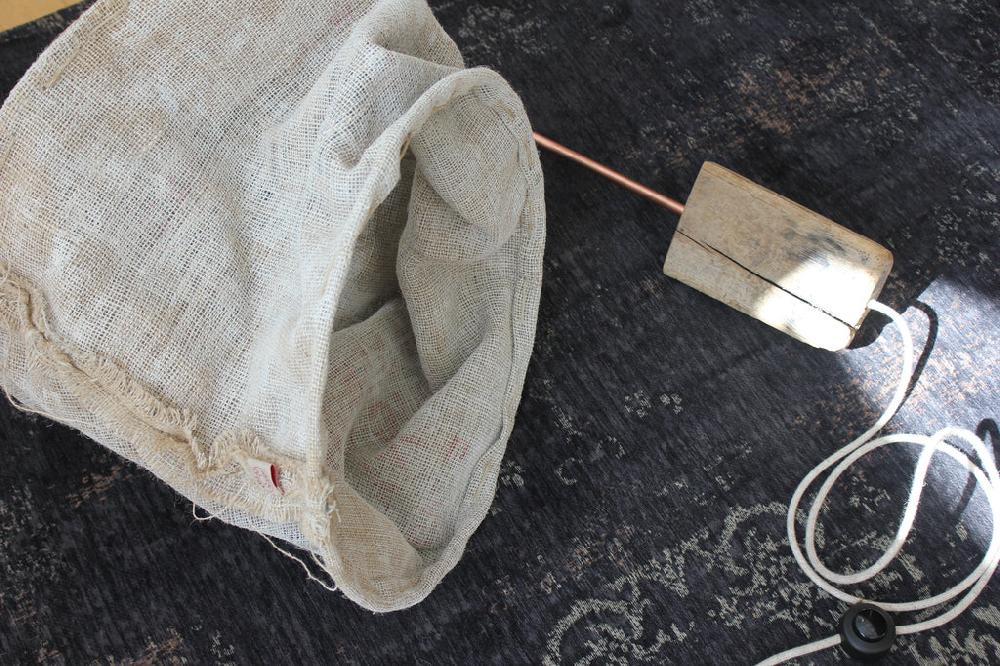 Greige Copper Tube And Driftwood Wall Lamp With Rough Linen Sack Shade