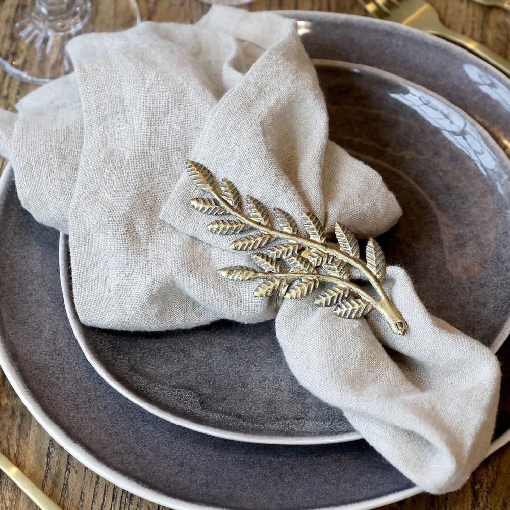 Greige Four Fern Leaf Napkin Rings - Antique Brass