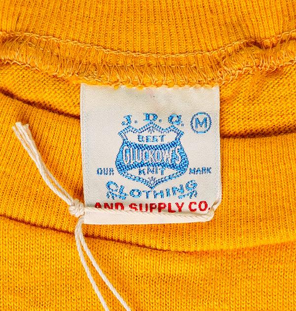 Guilty Parties John Gluckow Standard Pocket Tee - Gold