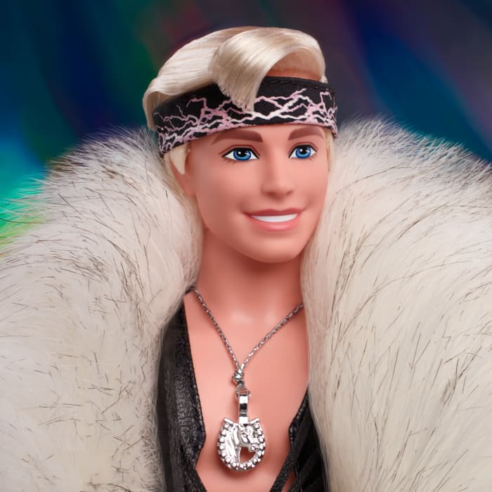 Hot Wheels Barbie The Movie Collectible Ken Doll Wearing Faux Fur Coat And Black Fringe Vest
