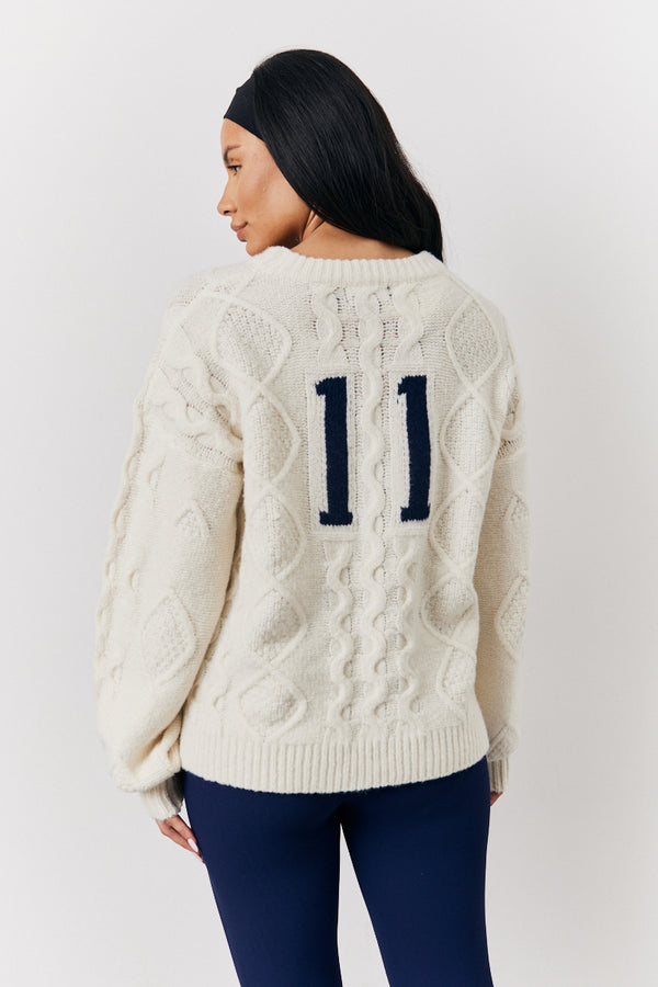 in the style Fits Cream 90's Varsity Cable Knitted Sweater Cream