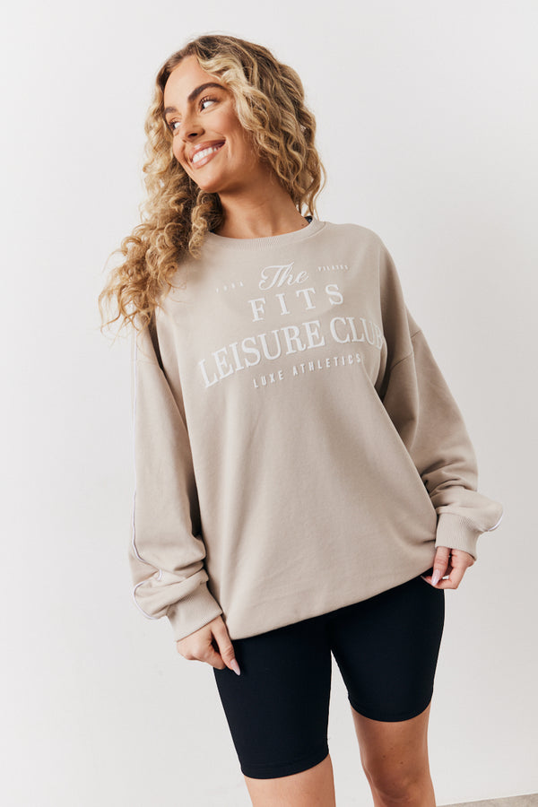 in the style Fits Stone Fits Leisure Club Graphic Oversized Sweatshirt Stone
