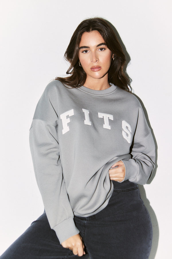 in the style {# Title already starts with vendor: print nothing extra #}Fits Slogan Knitted Crew Neck Sweatshirt Slate