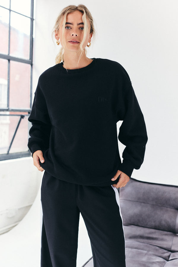in the style {# Title already starts with vendor: print nothing extra #}Fits Tonal Embroidered Sweatshirt Black