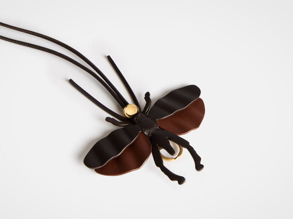 j.w.anderson Moth charm in chocolate brown