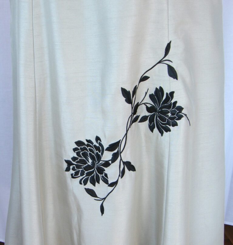 Jacques Vert PISTACHIO & MILK CHOCOLATE RANGE DRESS & JACKET IN SHOT TAFFETA WITH A HINT OF GREEN EMBROIDERED WITH BLACK FLOWERHEADS