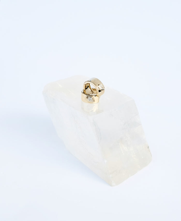 jnb Teardrop Huggies pave set (peat-shape) diamond on wide 14k yellow gold band