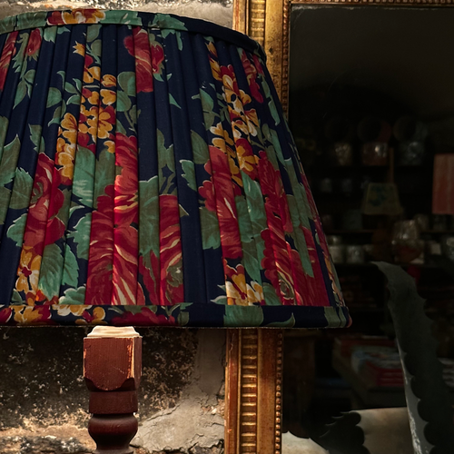 John Derian 14" Saved NY Pleated Fabric Lampshade #4122 Add To Cart Illuminate Your Space With The Bespoke Charm of This One-of-a-kind Hand-pleated Roller Print Fabric Lampshade In Shades Of Red Blue And Green. Crafted In Turke
