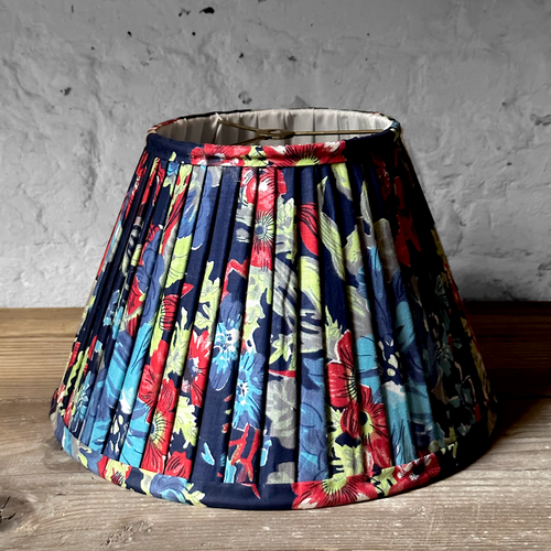 John Derian 14" Saved NY Pleated Fabric Lampshade Pair E Add To Cart Illuminate Your Space With The Bespoke Charm of This One-of-a-kind Hand-pleated Roller Print Fabric Lampshade In Shades Of Red Blue And Green. Crafted In Turk