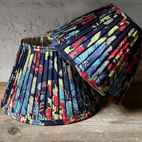 john derian 14" Saved NY Pleated Fabric Lampshade Pair E Add to cart Illuminate your space with the bespoke charm of this one-of-a-kind hand-pleated roller print fabric lampshade in shades of red blue and green. Crafted in Turk