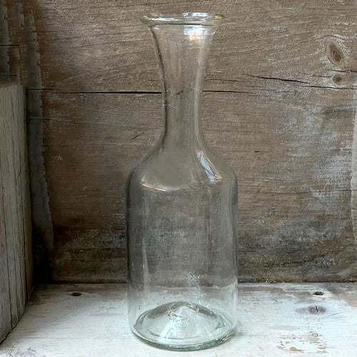 john derian Alisha Carafe Add to cart This piece can be used as a carafe or vase. Details 3" W x 9" H Recycled Glass Each item will feature unique variations Made in France Tunisia and Turkey Please note that because this it