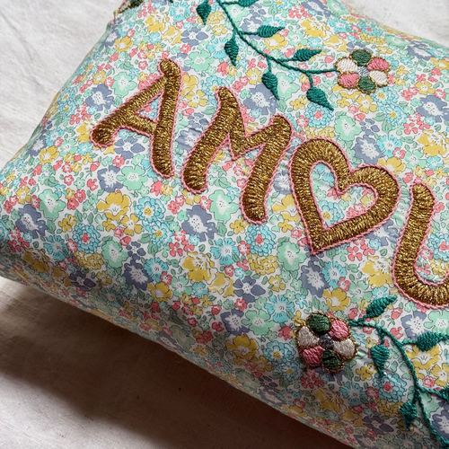 John Derian "Amour" Embroidered Cushion (CS 09-01) Add To Cart The "Amour" Embroidered Pillow By CSAO Features A Charming Floral Print Motif Hand-embroidered Lettering And Flowers Showcasing West African Craftsmanship. Notably E