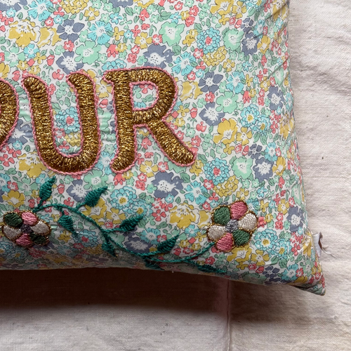 John Derian "Amour" Embroidered Cushion (CS 09-01) Add To Cart The "Amour" Embroidered Pillow By CSAO Features A Charming Floral Print Motif Hand-embroidered Lettering And Flowers Showcasing West African Craftsmanship. Notably E