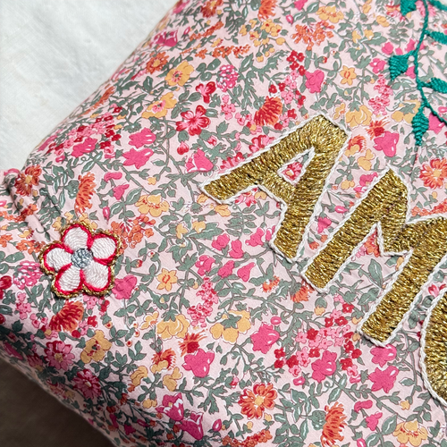 John Derian "Amour" Embroidered Cushion (CS 09-10) Add To Cart The "Amour" Embroidered Pillow By CSAO Features A Charming Floral Print Motif Hand-embroidered Lettering And Flowers Showcasing West African Craftsmanship. Notably E