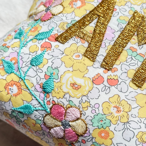 John Derian "Amour" Embroidered Cushion (CS 09-11) Add To Cart The "Amour" Embroidered Pillow By CSAO Features A Charming Floral Print Motif Hand-embroidered Lettering And Flowers Showcasing West African Craftsmanship. Notably E