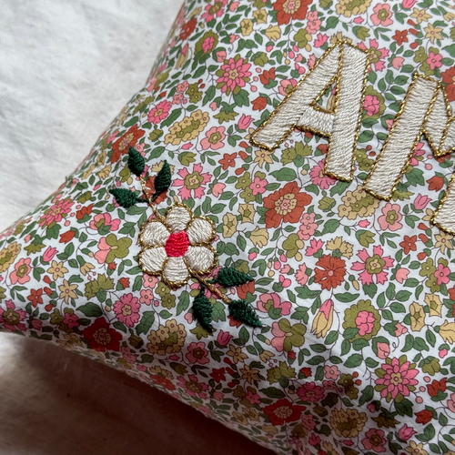 John Derian "Amour" Embroidered Cushion (CS 09-12) Add To Cart The "Amour" Embroidered Pillow By CSAO Features A Charming Floral Print Motif Hand-embroidered Lettering And Flowers Showcasing West African Craftsmanship. Notably E