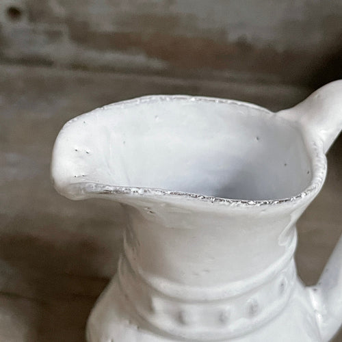 John Derian Aphrodite Vase Add To Cart Pitcher 3.5" L X 3.5" W X 4.1" H Black Terra Cotta With White Enameled Glaze Each Item Will Feature Unique Variations Made In Paris Care Dishwasher Safe On A Moderate Wash Cycle. Not Mic