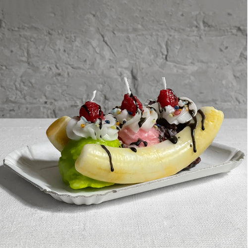john derian Banana Split Candle Add to cart Details 7.75" L x 3.75" W x 3" H Paraffin Wax Each item will feature unique variations Made in Italy Care Remove All Paper Before Burning. Not intended for children.   Cereria Intron