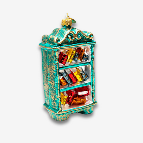 john derian Bookcase Ornament Add to cart All Holiday ornaments and items are final sale and are not eligible for return or exchange.  Details Glass Handblown in Poland Please note all ornaments and holiday items are not avai