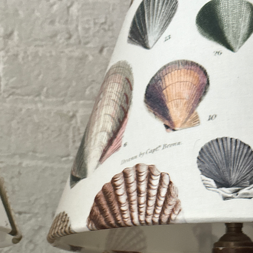 John Derian Custom John Derian For Designers Guild "Captain Thomas Brown Shells Oyster" Lampshade Pair Add To Cart Details Made From John Derian For Designers Guild "Captain Thomas Brown Shells Oyster" Collaboration Fabric. Sold