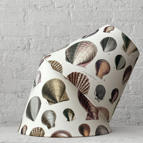 John Derian Custom John Derian For Designers Guild "Captain Thomas Brown Shells Oyster" Lampshade Pair Add To Cart Details Made From John Derian For Designers Guild "Captain Thomas Brown Shells Oyster" Collaboration Fabric. Sold