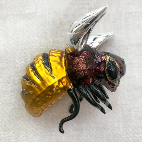 john derian Dark Bumblebee Ornament Add to cart All Holiday ornaments and items are final sale and are not eligible for return or exchange. Details 3.5" W x 3" H Handblown in Poland Please note all ornaments and holiday item