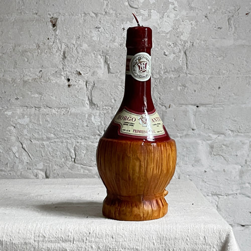 john derian Fiaschetto Vino Red Chianti Wine Basket Bottle Candle Add to cart Details 10" H Paraffin Wax Each item will feature unique variations Made in Italy Care Remove All Paper Before Burning. Not intended for children.  