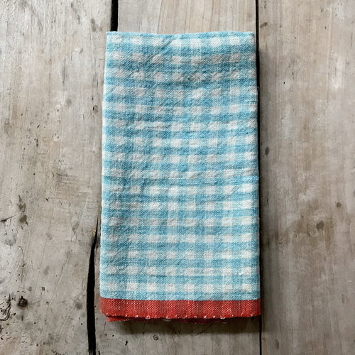 john derian Gingham Tea Towel in Aqua & Orange Add to cart Details 30" x 20" 100% Hand-Spun Linen Made in India Care Machine wash cold Gentle cycle Tumble dry. Do not Bleach.     Caravan a celebrated home and lifestyle brand