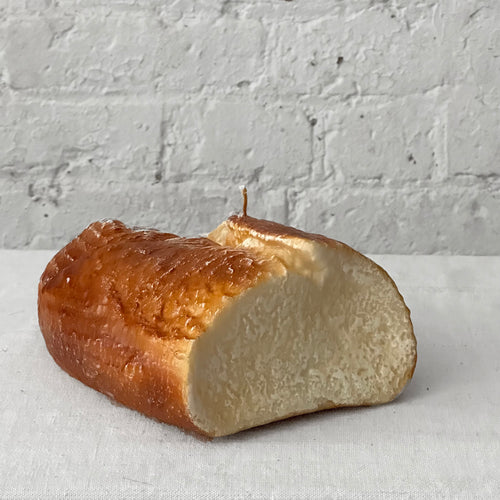 john derian Half Loaf Candle Add to cart Details 6" L x 7" W x 2.5" H Paraffin Wax in glass container Each item will feature unique variations Made in Italy Care Remove All Paper Before Burning. Not intended for children.   C