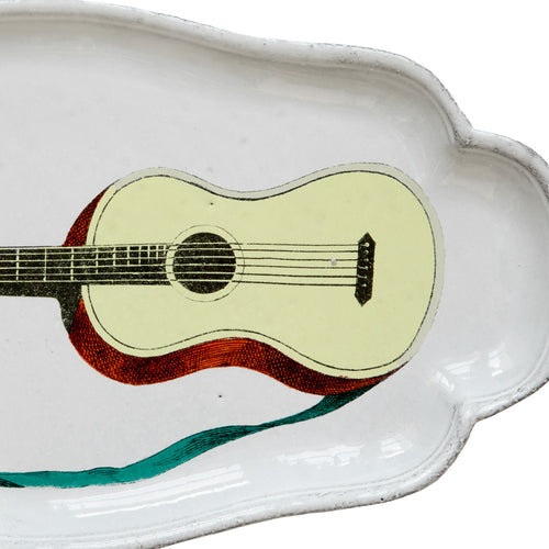 John Derian John Derian Guitar Platter Add To Cart Details 10.75" L X 6" W X .5" Deep Glazed Terracotta Made In Paris Care Dishwasher Safe On A Moderate Wash Cycle. Not Microwave Safe. Image Origin "The Instructive Picture Book