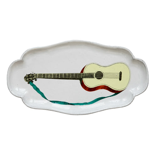 john derian John Derian Guitar Platter Add to cart Details 10.75" L x 6" W x .5" Deep Glazed terracotta Made in Paris Care Dishwasher safe on a moderate wash cycle. Not microwave safe. Image Origin "The Instructive Picture Book