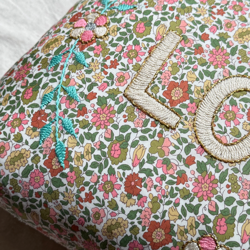 John Derian "Love" Embroidered Cushion (CS 09-07) Add To Cart The "Love" Embroidered Pillow By CSAO Features A Charming Floral Print Motif Hand-embroidered Lettering And Flowers Showcasing West African Craftsmanship. Notably Eac