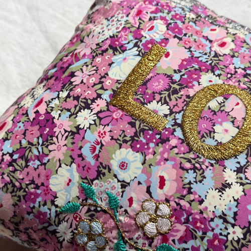 John Derian "Love" Embroidered Cushion (CS 09-08) Add To Cart The "Love" Embroidered Pillow By CSAO Features A Charming Floral Print Motif Hand-embroidered Lettering And Flowers Showcasing West African Craftsmanship. Notably Eac
