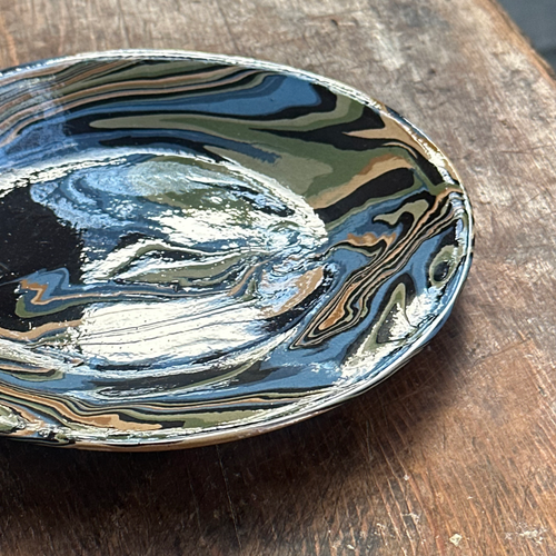 John Derian Marbled Small Plate In Papeete (PP 05) Add To Cart This Hand Crafted Small Side Plate By Sylvie Saint-Andre Perrin Is Expertly Made With Intricate Swirls In Hues Of Light Blue Blue Dark Blue Yellow Ochre Yellow Light