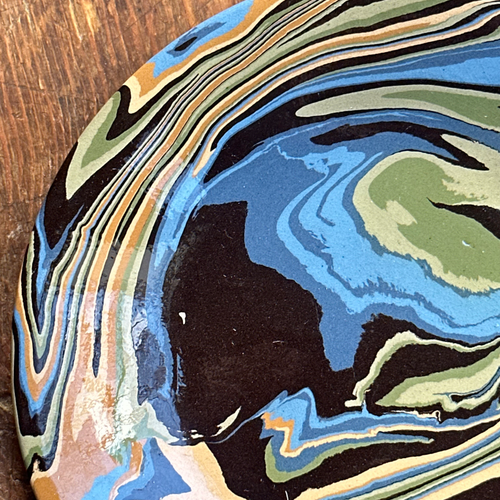 John Derian Marbled Small Plate In Papeete (PP 05) Add To Cart This Hand Crafted Small Side Plate By Sylvie Saint-Andre Perrin Is Expertly Made With Intricate Swirls In Hues Of Light Blue Blue Dark Blue Yellow Ochre Yellow Light