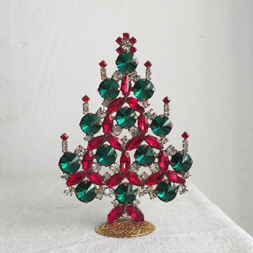 john derian Nostalgic Jeweled Tree with Candles Add to cart All Holiday ornaments and items are final sale and are not eligible for return or exchange.  Details 3.5" W x 5" H Glass jewels Handmade in Germany Please note all o