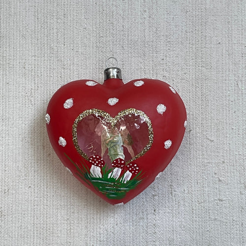john derian Nostalgic Large Red Heart with Angel Inside Ornament Add to cart All Holiday ornaments and items are final sale and are not eligible for return or exchange.  Details approx. 3.5" W x 4" H Glass Handblown in Poland